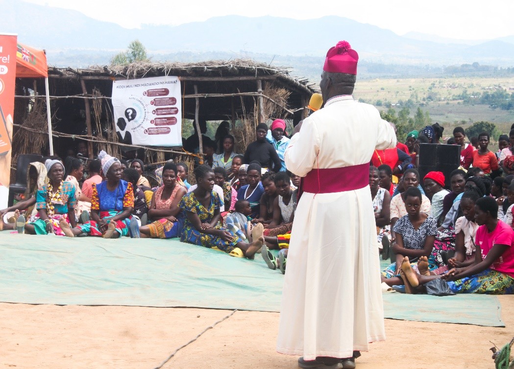 A picture of Archbishop Thomas Luke Msusa addressing the beneficiaries